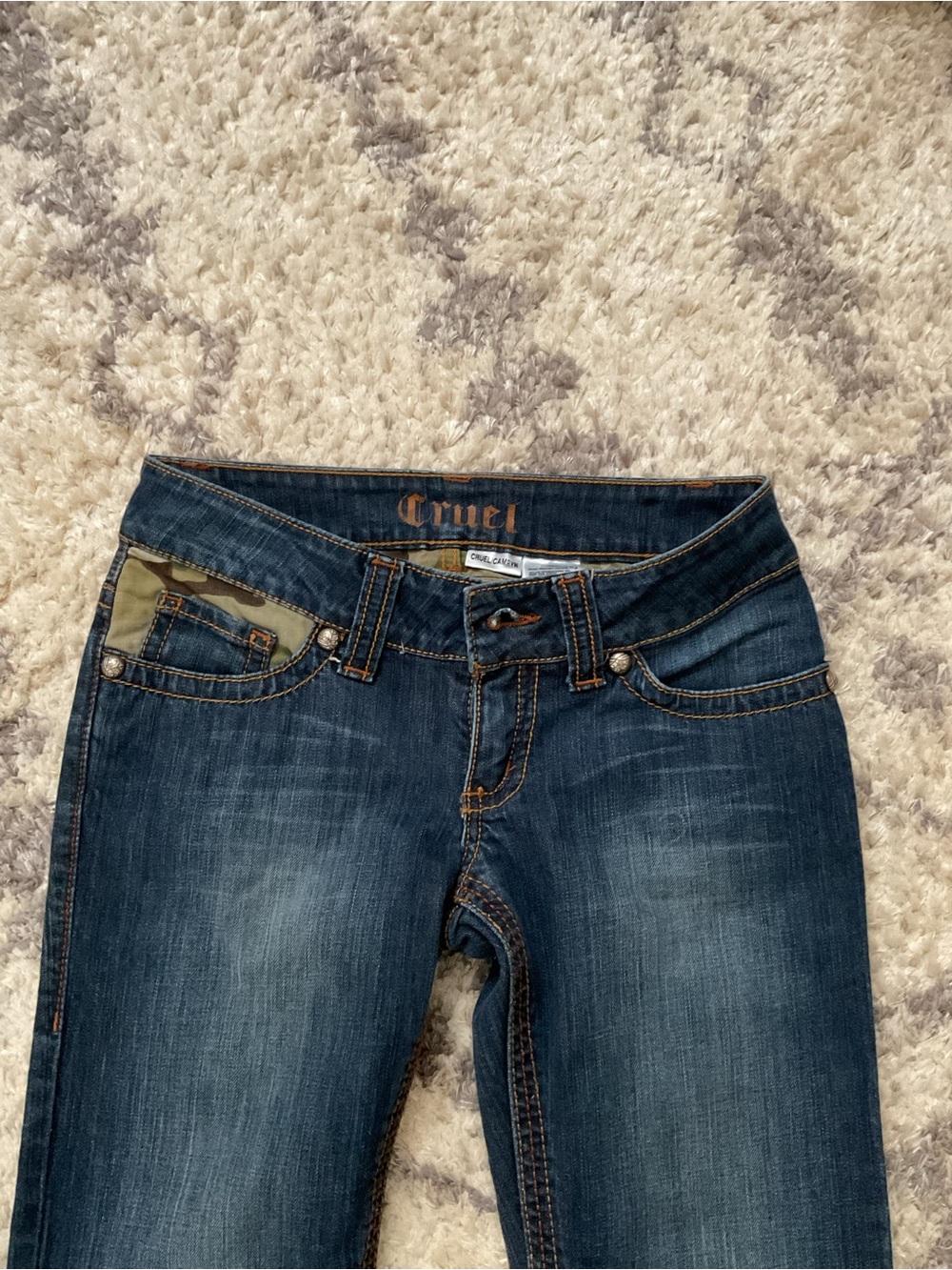 Cruel Y2K low rise bootcut jeans with camouflage pocket detail
Size 1R